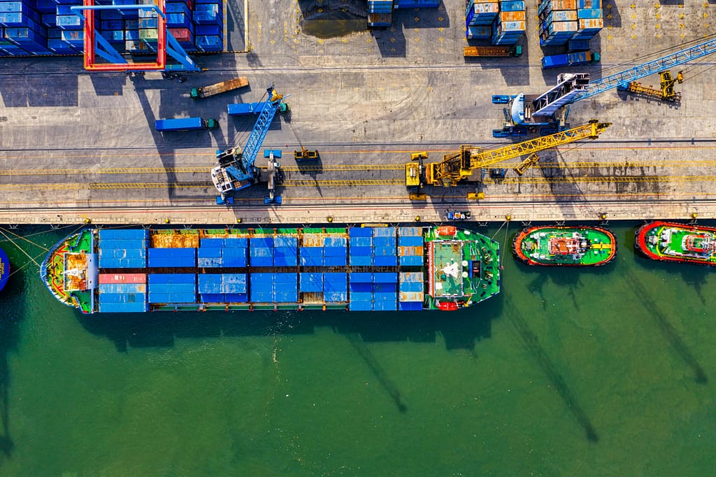 Aerial photograph showcasing vibrant cargo operations at a bustling port in North Jakarta, Indonesia.